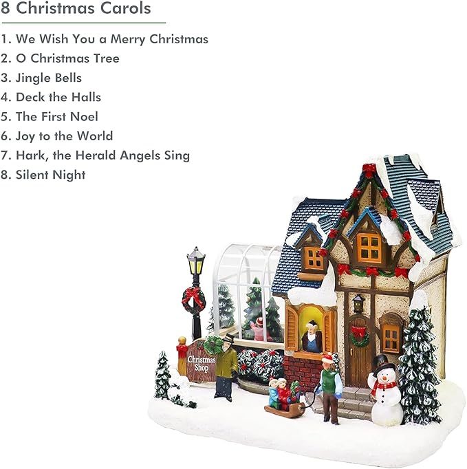 MOMENTS IN TIME Christmas Village Building Lighted Christmas Shop with LED Lights, Music & Snowman Battery Operated or Plug-in Vintage Holiday Village House Décor 8.5”H x 9.8”W x 6.9”D