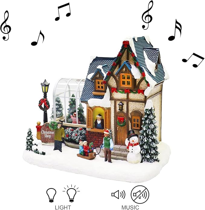MOMENTS IN TIME Christmas Village Building Lighted Christmas Shop with LED Lights, Music & Snowman Battery Operated or Plug-in Vintage Holiday Village House Décor 8.5”H x 9.8”W x 6.9”D