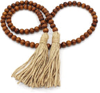 CVHOMEDECO. Wood Grain Beads Garland with Tassels Farmhouse Rustic Wooden Prayer Bead String Wall Hanging Accent for Home Festival Decor. Dark Tan