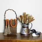 CVHOMEDECO. Wood Beads Garland with Tassels Farmhouse Rustic Wooden Prayer Bead String Wall Hanging Accent for Home Festival Decor. Orange