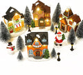 Aneco 19 Pieces Christmas Village Set Resin Christmas Houses with Santa Claus Snowman Figurines, LED Light Lamps, and Pine Trees, Xmas Town Scene Building Ornaments for Winter Home Desktop Decor Gift
